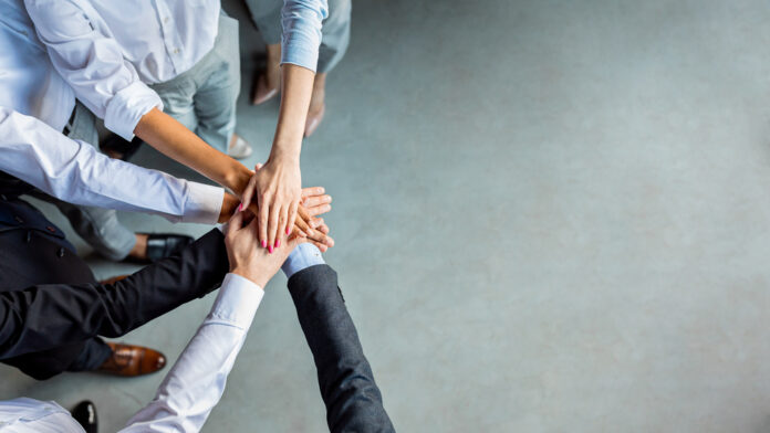 Teambuilding,And,Togetherness.,Unrecognizable,Business,People,Holding,Hands,Standing,In